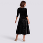 Essyro black velvet midi dress with floral jacquard pattern, square neckline, long sleeves, and A-line skirt
