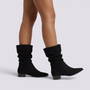 Botas caña media mujer slouch punta fina negras vista lateral