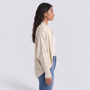 Cárdigan mujer abierto de punto con manga murciélago y cuello chal en color crema, vista lateral