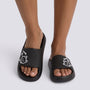 Chanclas de plataforma negras con gato en relieve, vista frontal