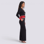 Conjunto punto mujer cárdigan bicolor y pantalón ancho en color negro con detalles rojos, vista lateral