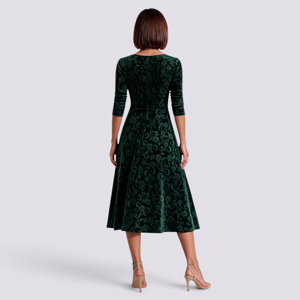 Essyro midi dress in dark green velvet with floral jacquard pattern, long sleeves, and A-line skirt, back view.