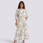 Essyro two-piece set with a cream top and maxi skirt featuring a black abstract line art print and dolman sleeves.