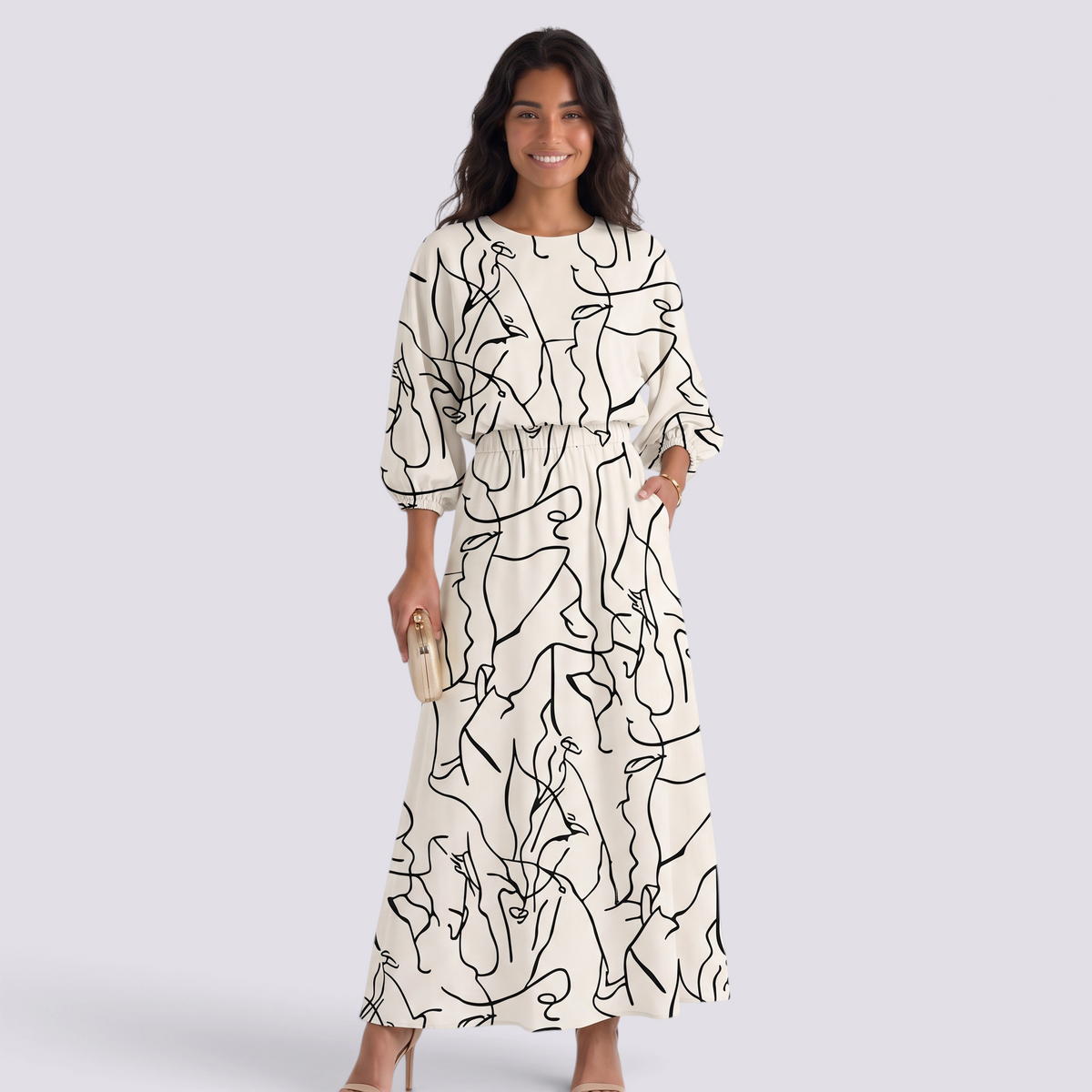 Essyro two-piece set with a cream top and maxi skirt featuring a black abstract line art print and dolman sleeves.