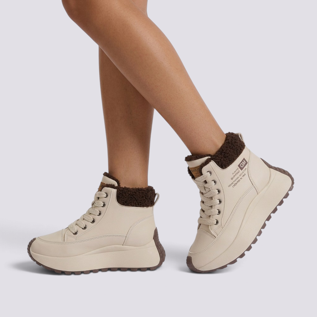 Essyro beige faux leather high-top platform sneakers with brown faux fur lining and lace-up closure on a model