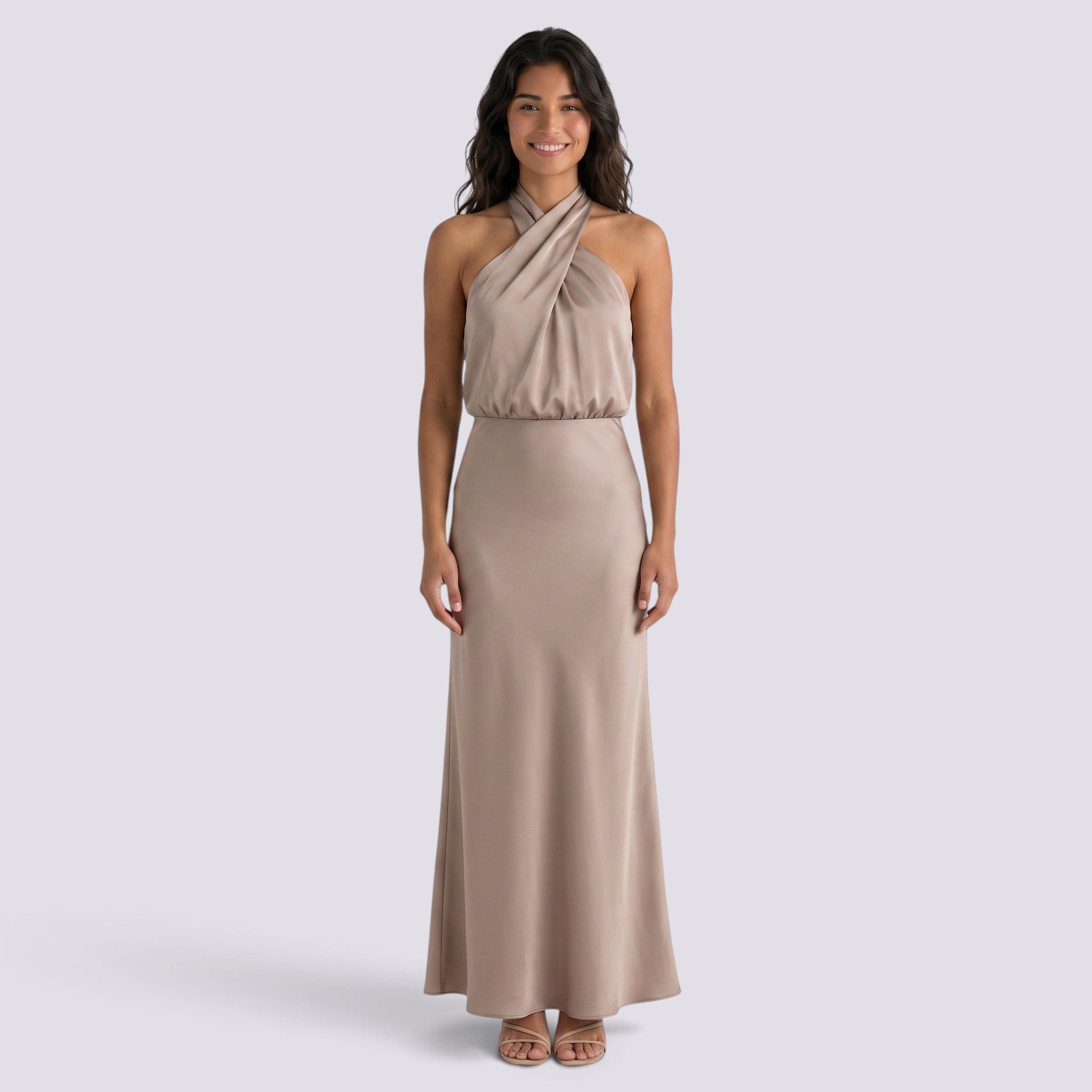 Essyro beige satin maxi dress with a draped halter neckline worn by a smiling model on a neutral background.