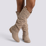 Essyro beige knee-high boots with a slouchy suede-effect finish, low block heel, and decorative ankle strap.