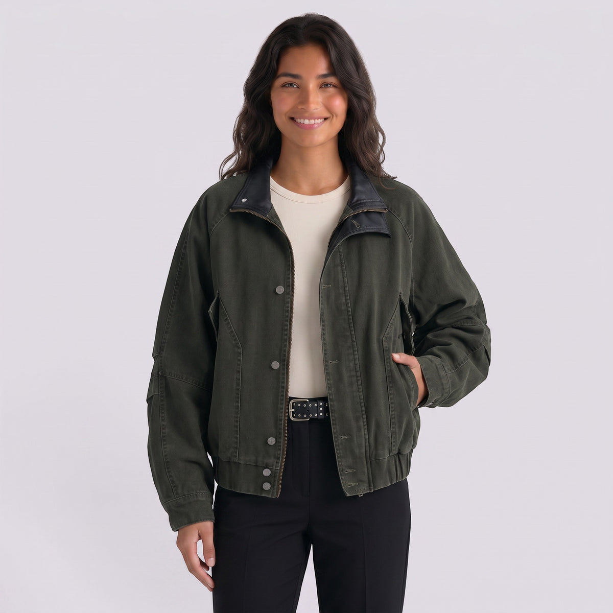 Essyro bicolor jacket in dark green with a black faux leather collar worn by a smiling woman