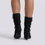 Essyro black mid-calf boots with buckle details and a comfortable kitten heel, worn on a model against a white background