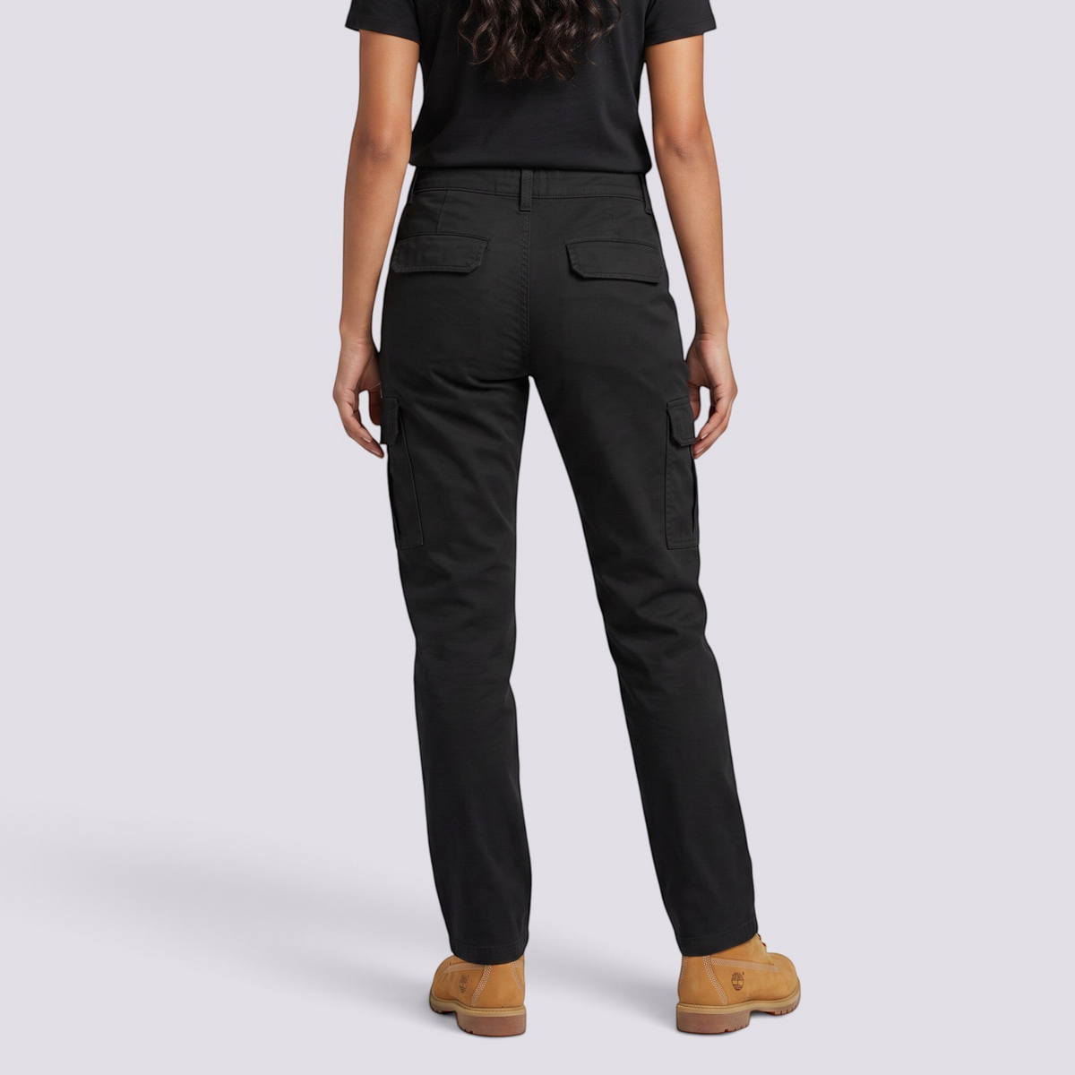 Essyro women's black cargo jeans with a straight leg fit, utility pockets, and a washed effect, back view.