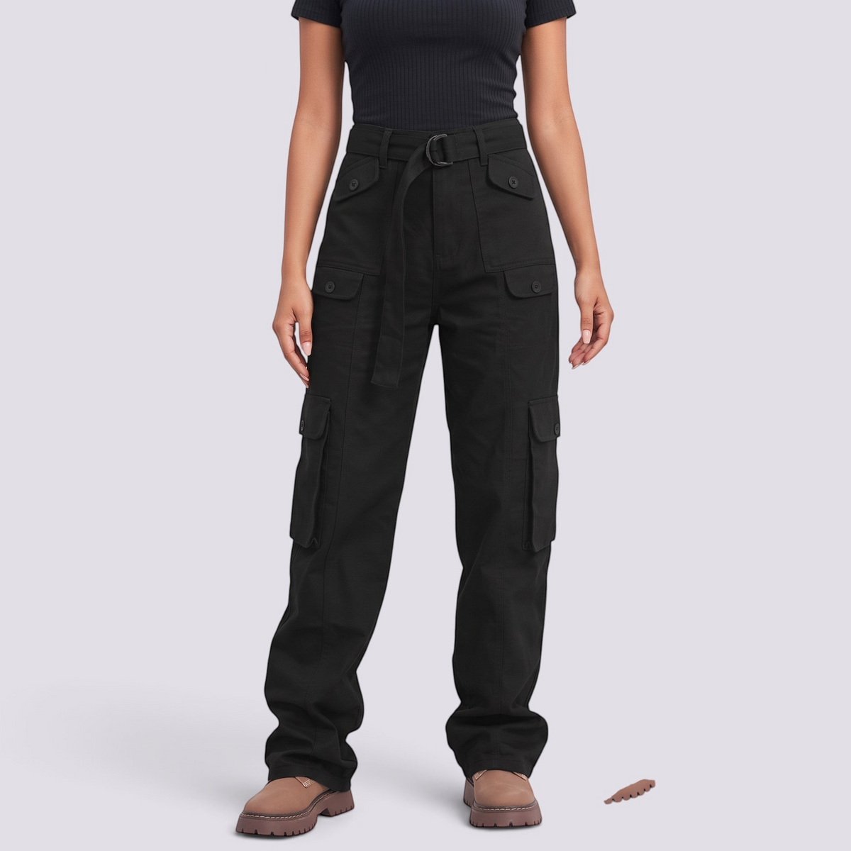 Essyro black cargo jeans with utility pockets, straight leg fit, and belted waist on a model wearing a black top.