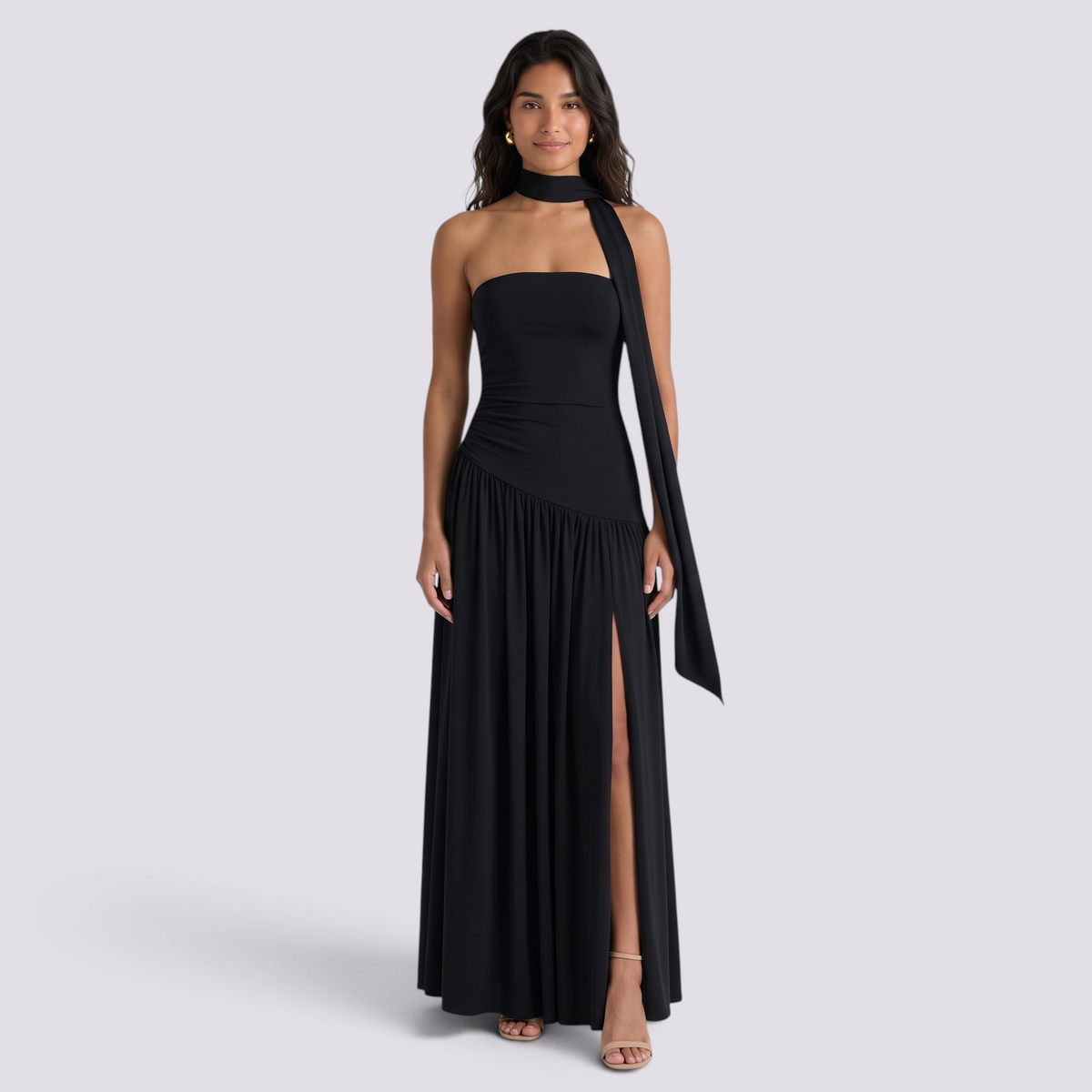 Essyro black floor-length evening gown with a halter neckline, strapless bodice, and an asymmetric draped skirt.