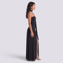 Essyro black floor-length evening dress with halter neck, draped asymmetric skirt, and side slit on a model