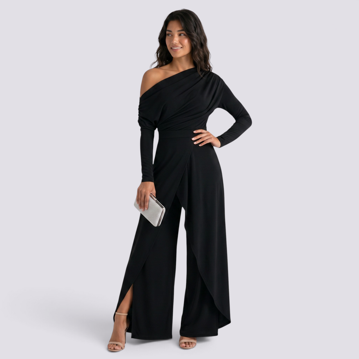Essyro black one-shoulder jumpsuit with long draped sleeve and wide-leg trousers with front slit on a model