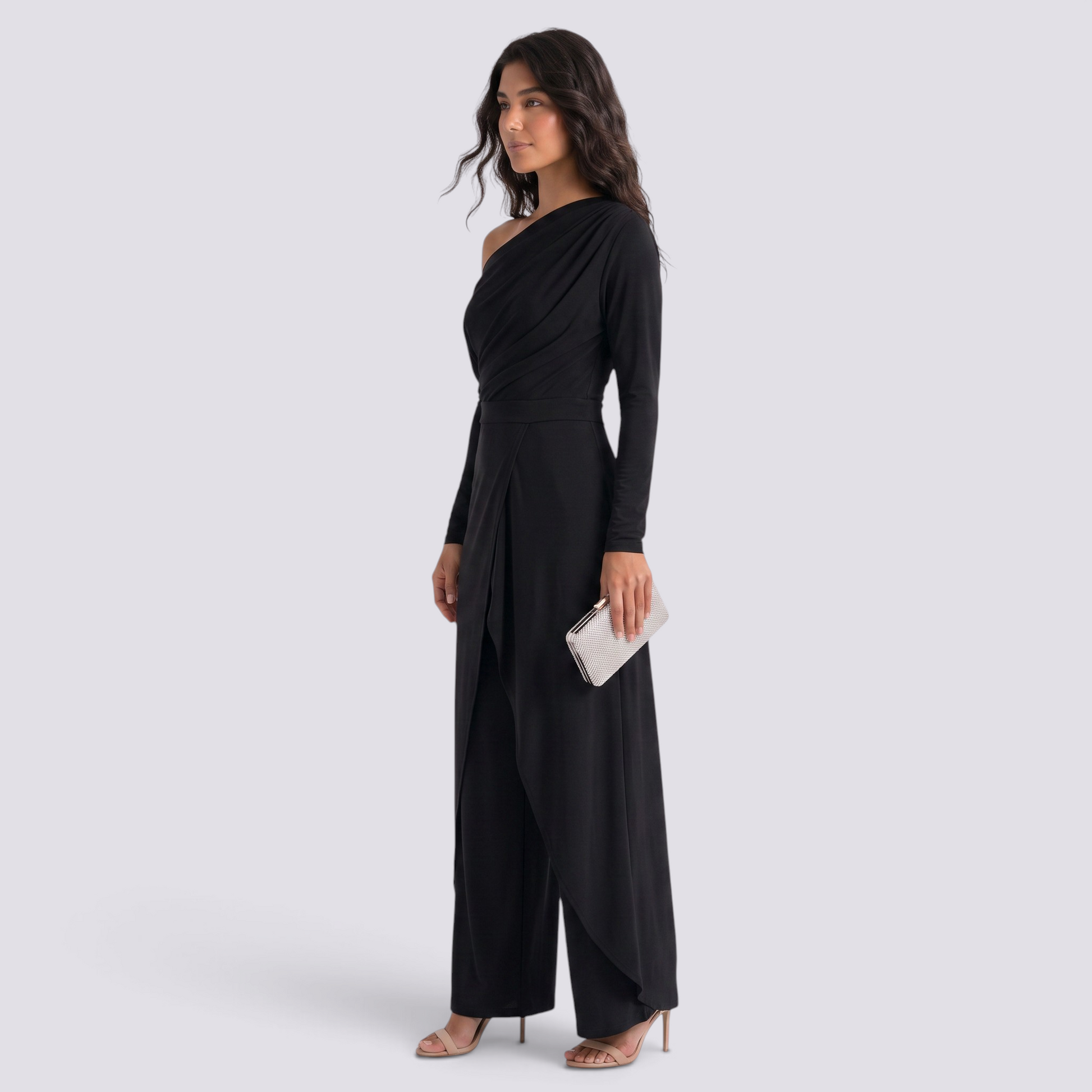 Essyro black one-shoulder jumpsuit with long draped sleeve, wide-leg trousers, and front slit on a model