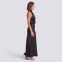 Essyro black satin halter neck maxi dress with draped bodice and flowing bias-cut skirt on a model, side view
