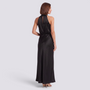 Essyro black satin halter neck maxi dress with open back and draped detail worn by a model, back view.