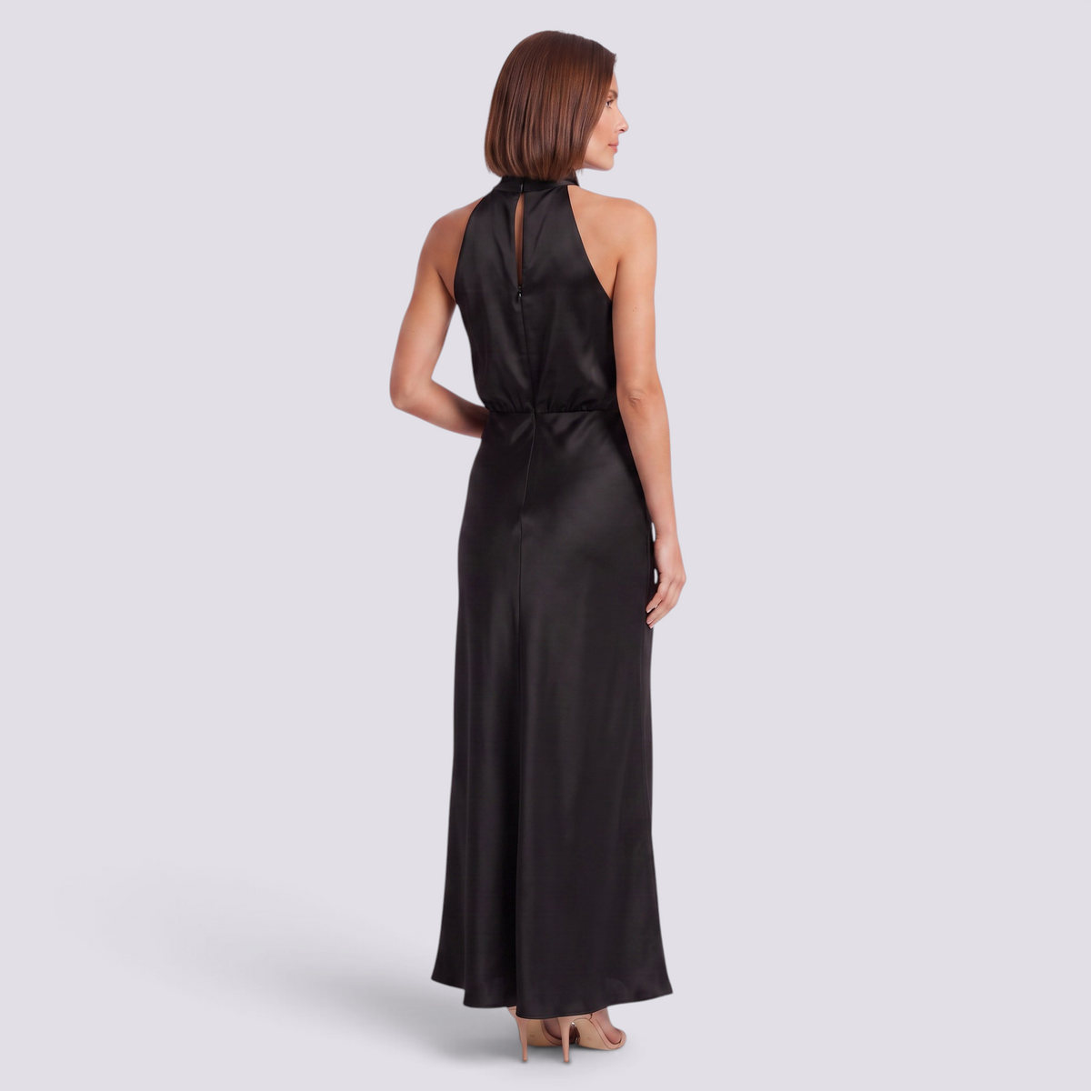 Essyro black satin halter neck maxi dress with open back and draped detail worn by a model, back view.