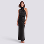 Essyro black satin maxi dress with a draped halter neckline and sleeveless design worn by a woman