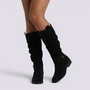 Essyro black knee-high boots with a slouchy suede-effect shaft, decorative ankle strap, and low block heel.