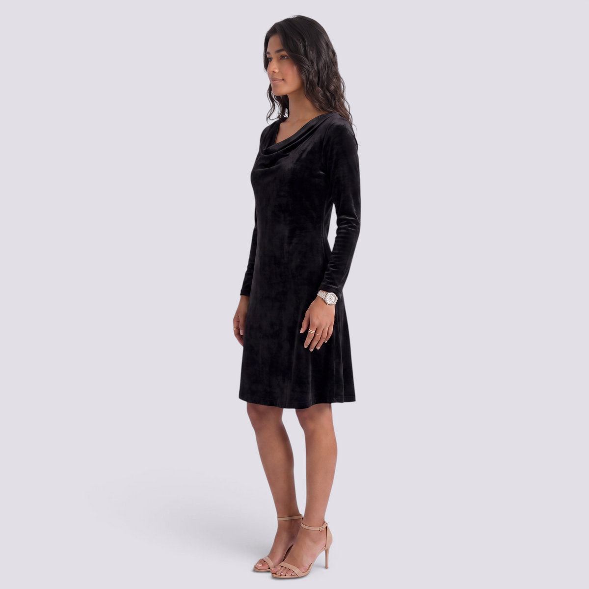 Essyro black velvet short dress with long sleeves and draped cowl neckline worn by a model in profile view