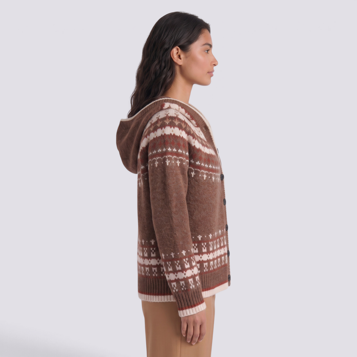 Essyro brown Nordic jacquard knit cardigan with hood and button closure worn by a woman, side view