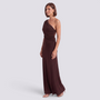 Essyro brown one-shoulder maxi dress with draped sleeve, ruched waist, and column skirt on a model