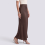 Essyro high-waisted brown satin mermaid maxi skirt with a fluid silhouette worn with beige heels