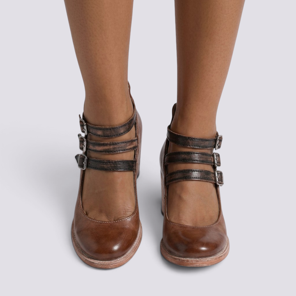 Essyro brown snake-effect leather heels with triple ankle buckles and a round toe block heel design.