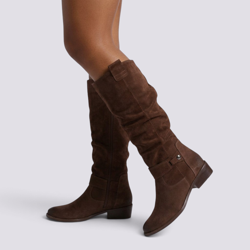 Essyro brown suede knee-high boots with a side zipper, buckle detail, and a comfortable square heel.