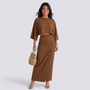 Essyro brown two-piece set with a cropped kimono-sleeve top and high-waisted maxi skirt worn by a smiling model.