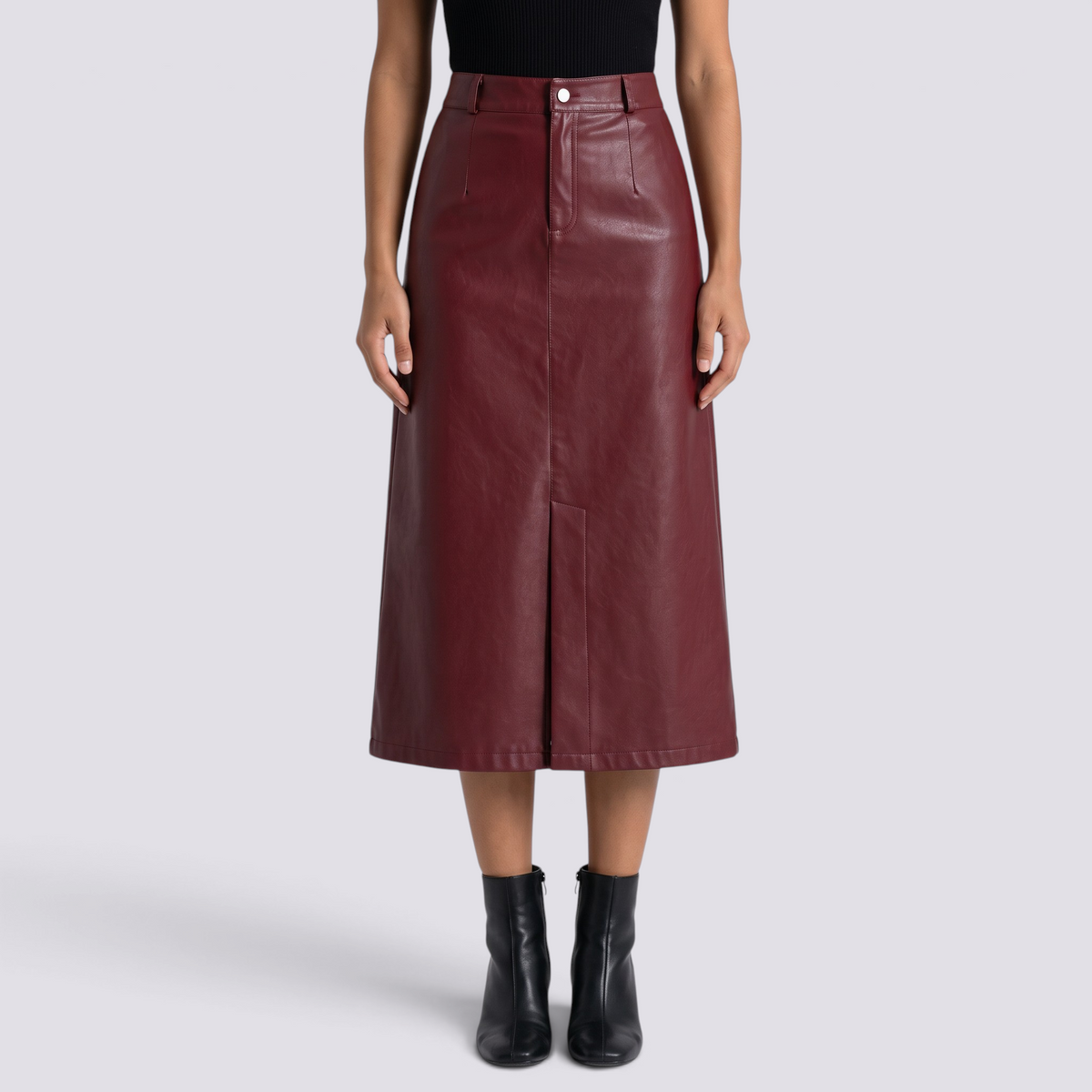 Essyro burgundy faux leather midi skirt with high waist, front slit, and button closure worn with black ankle boots