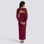 Essyro long-sleeve burgundy slim-fit dress with a back cutout and knot detail worn by a woman from behind