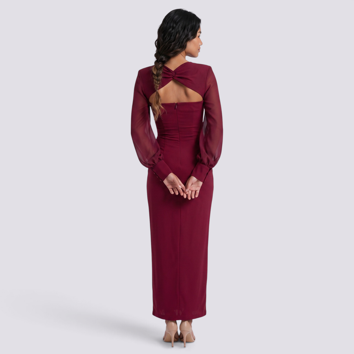Essyro long-sleeve burgundy slim-fit dress with a back cutout and knot detail worn by a woman from behind
