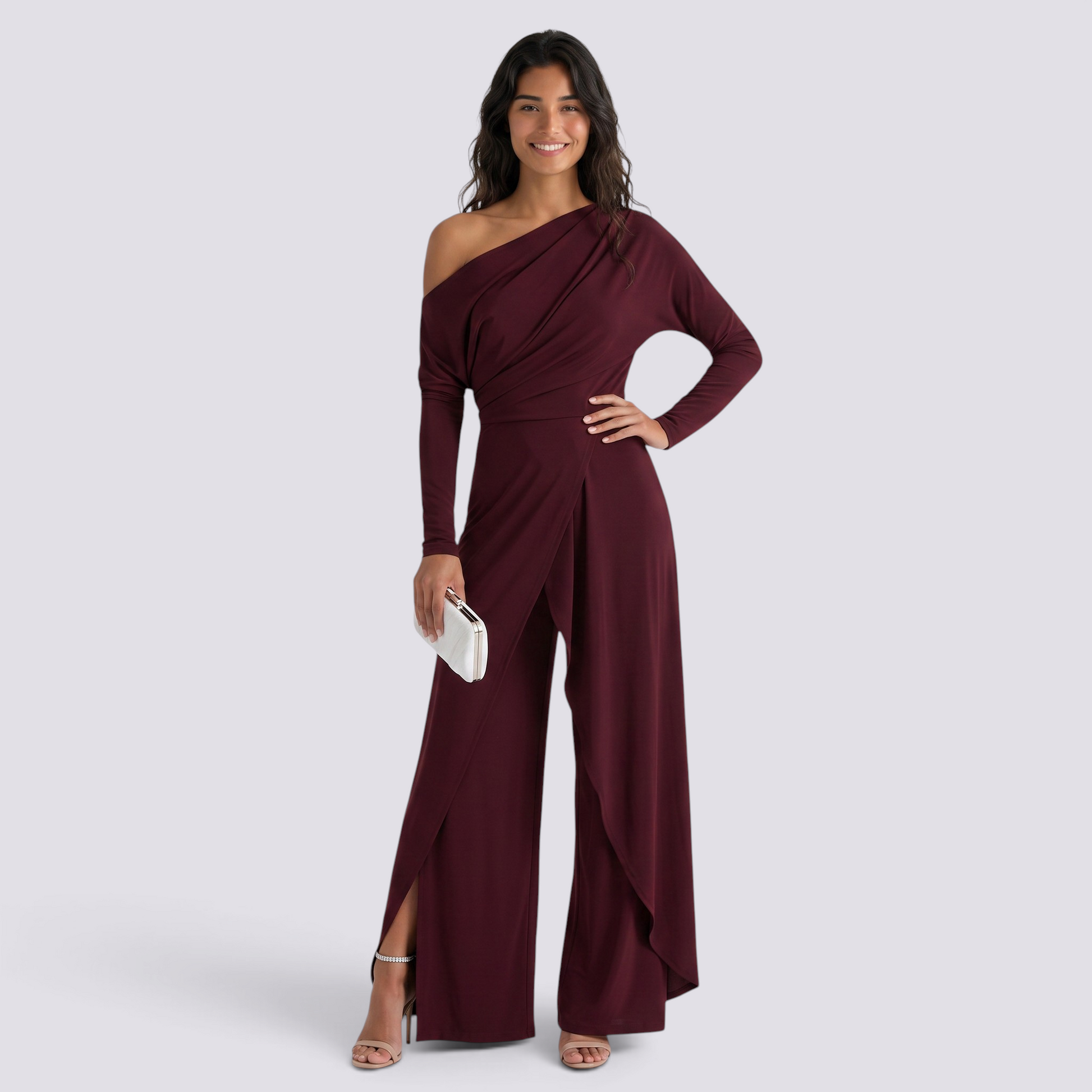 Essyro burgundy one-shoulder jumpsuit with long draped sleeve and wide-leg trousers with front slit on a model
