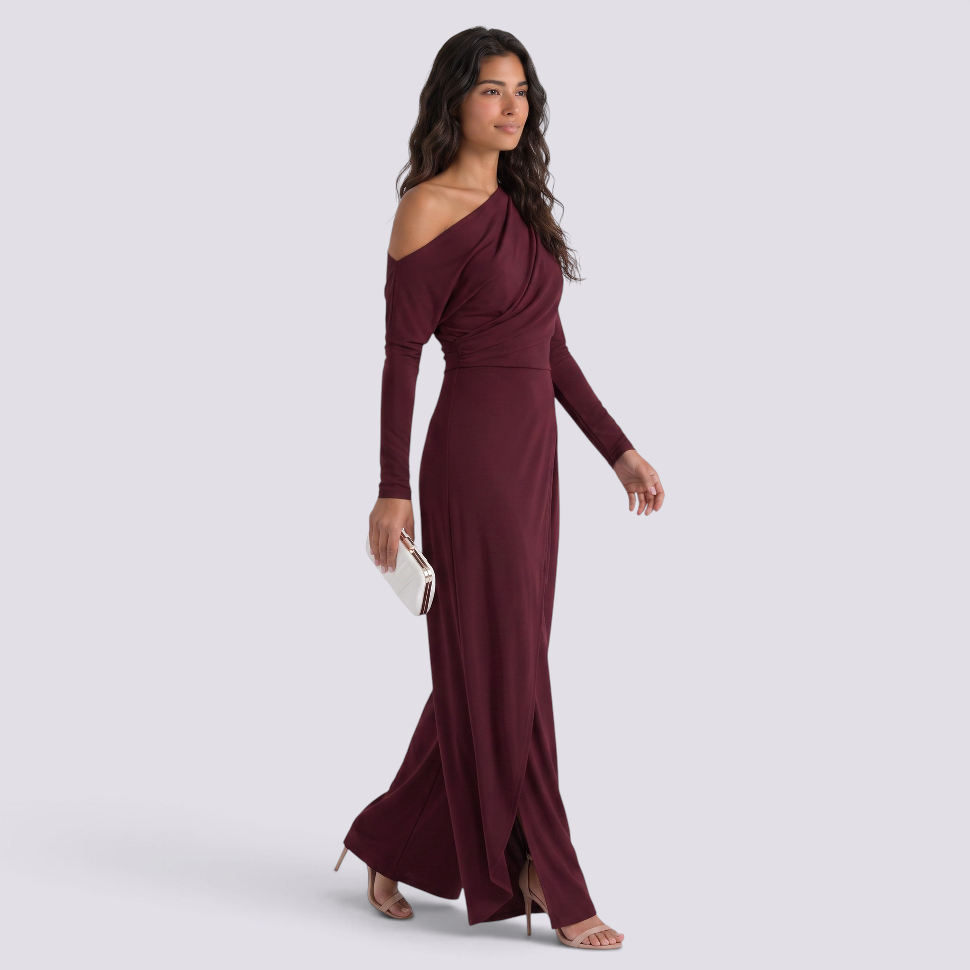 Essyro burgundy one-shoulder jumpsuit with draped long sleeve and wide-leg trousers worn by a model with a clutch.