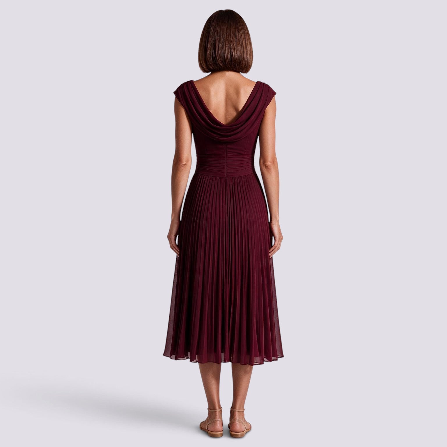Essyro burgundy midi dress with a draped boat neckline, pleated skirt, and cinched waist, back view on a model.