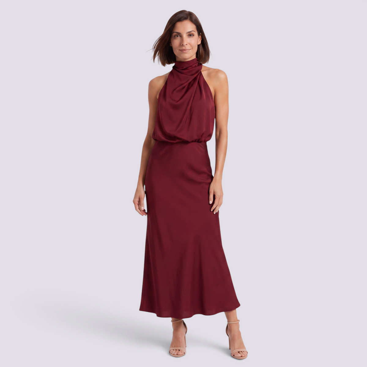 Essyro burgundy satin halter neck maxi dress with draped bodice and fluid bias-cut skirt worn by a model.