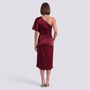 Essyro burgundy satin one-shoulder midi dress with an asymmetrical hem worn by a woman from the back view.