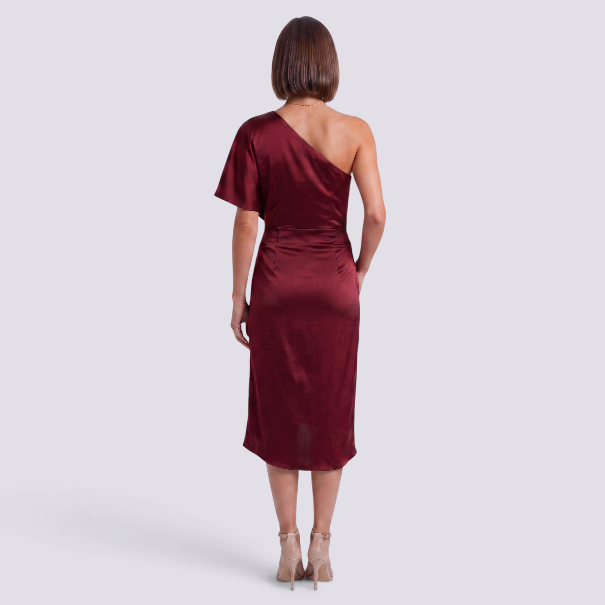 Essyro burgundy satin one-shoulder midi dress with an asymmetrical hem worn by a woman from the back view.