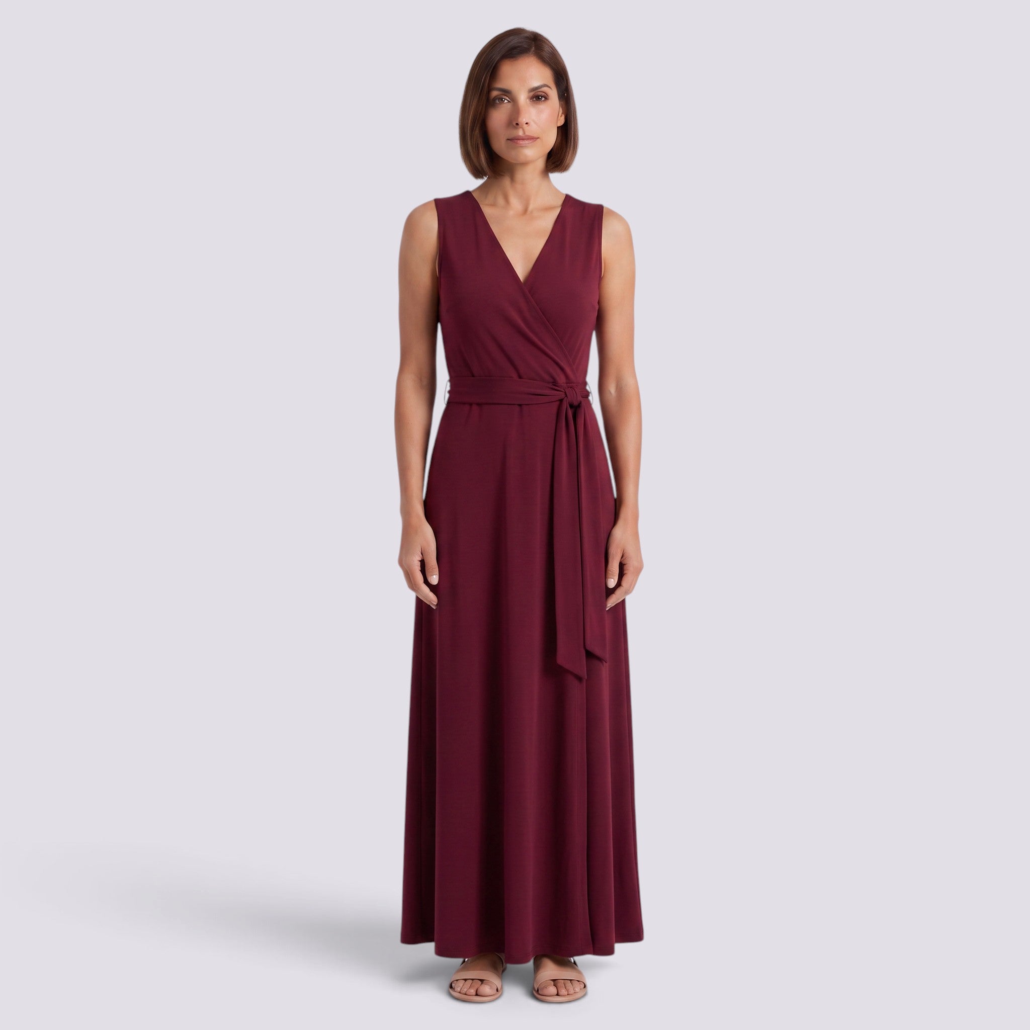 Essyro burgundy sleeveless maxi dress with V-neck and matching waist belt worn by a woman on a neutral background