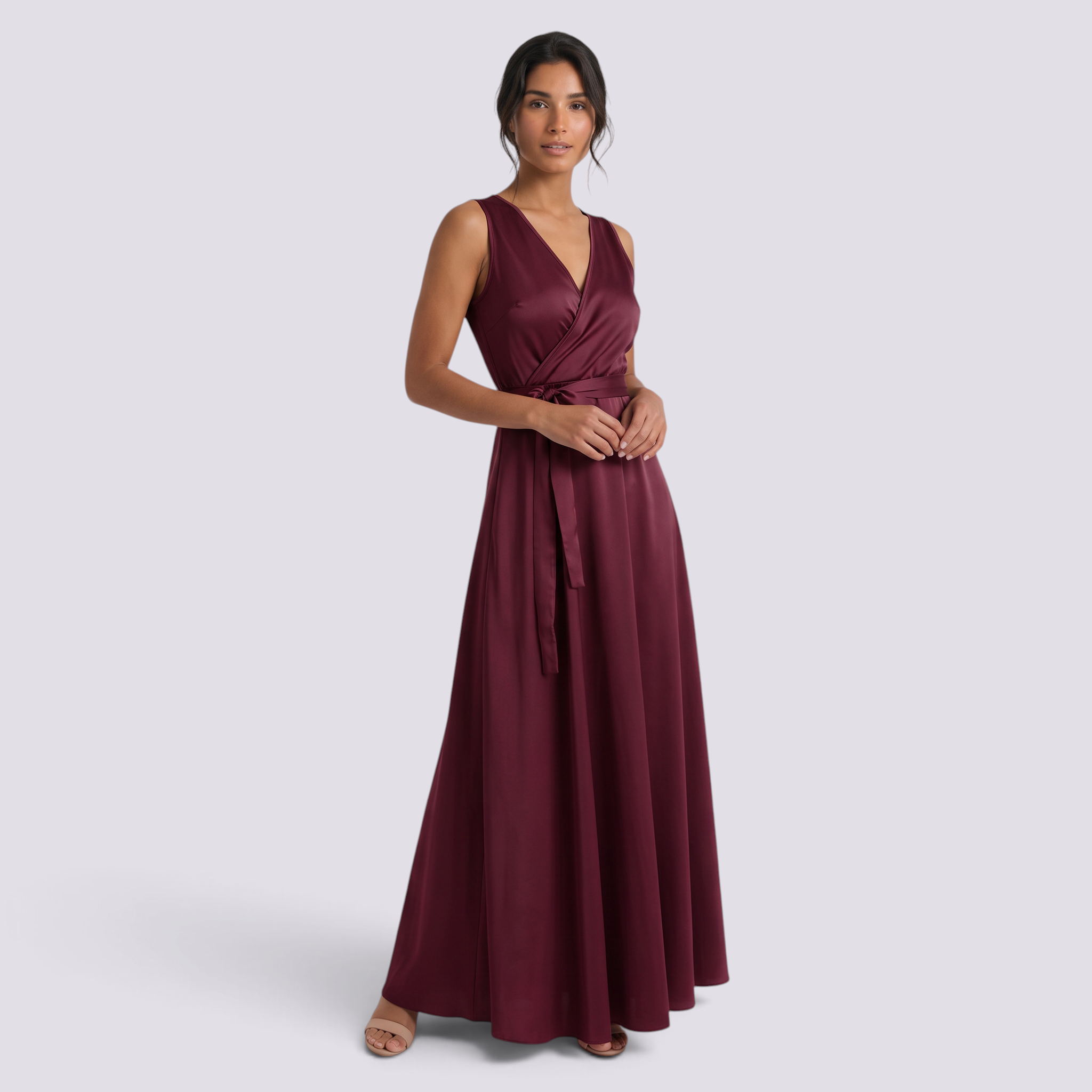 Model wearing an Essyro burgundy sleeveless maxi dress with a V-neck and matching waist belt on a light background