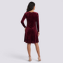 Essyro burgundy velvet short dress with long sleeves and a flared silhouette, back view on a model.