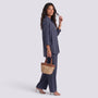 Essyro two-piece set featuring a charcoal grey loose long-sleeve shirt and wide-leg trousers on a woman.