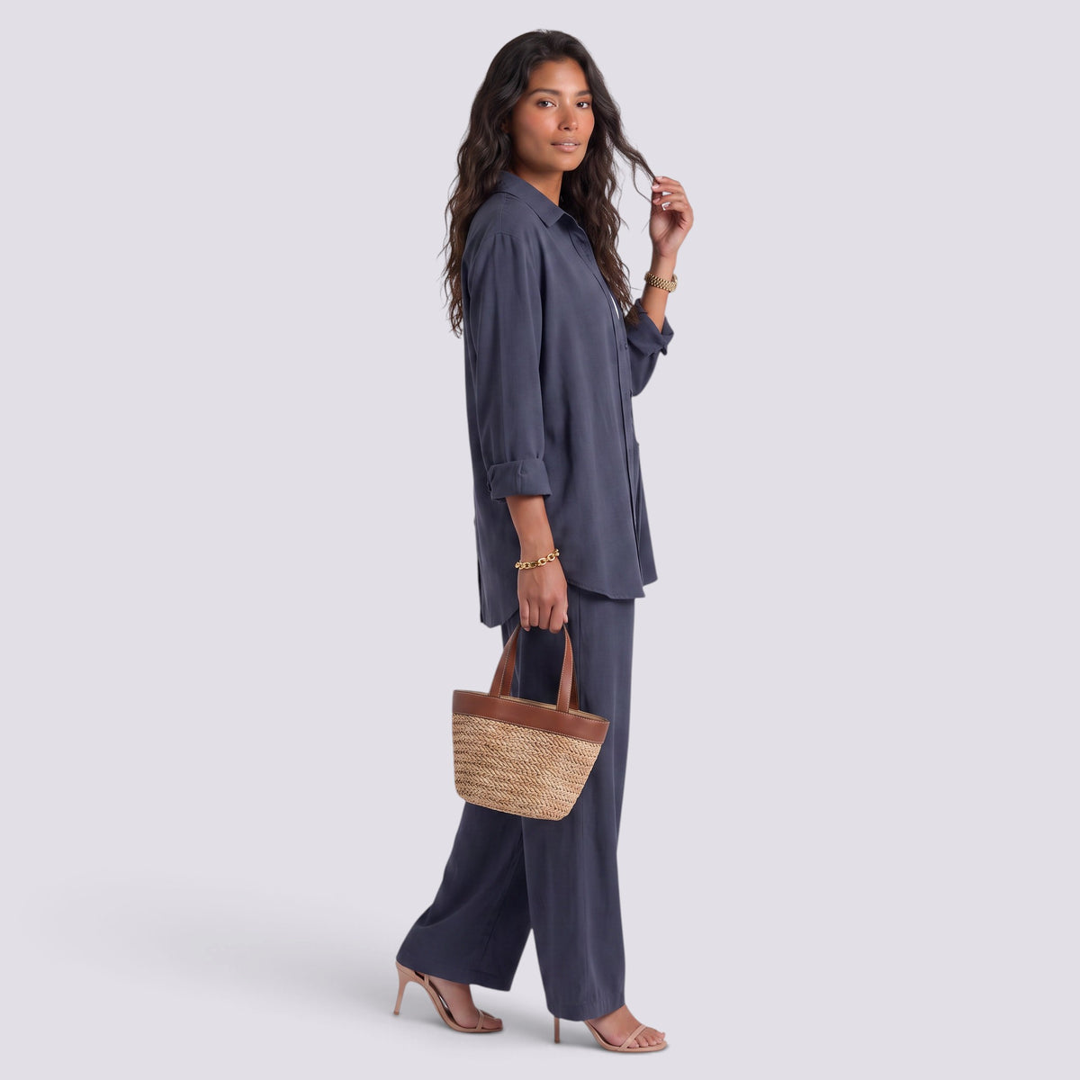 Essyro two-piece set featuring a charcoal grey loose long-sleeve shirt and wide-leg trousers on a woman.