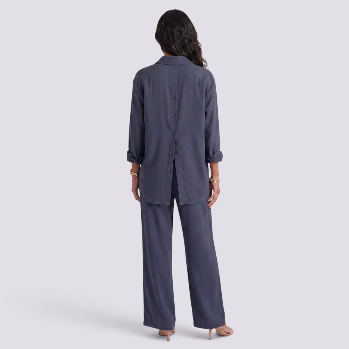 Essyro two-piece set featuring a charcoal grey long-sleeve button-back shirt and matching wide-leg trousers