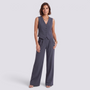 Essyro charcoal grey tailored vest and high-waisted palazzo pants set worn by a woman with a gold chain necklace.