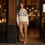 Essyro cream knit cardigan with Nordic jacquard pattern, high collar, and full zip, worn with tan trousers.