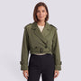 Essyro cropped olive green windbreaker jacket with belted waist and trench-style details worn by a woman