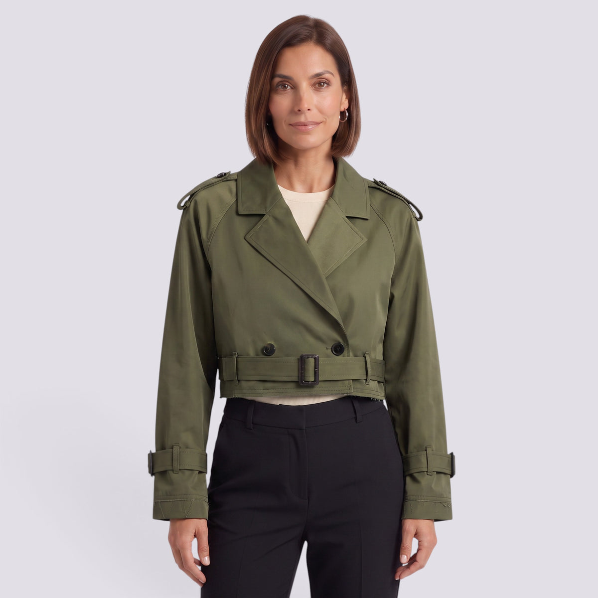 Essyro cropped olive green windbreaker jacket with belted waist and trench-style details worn by a woman